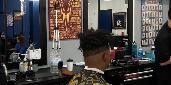 ASU barbershop interior with sports memorabilia