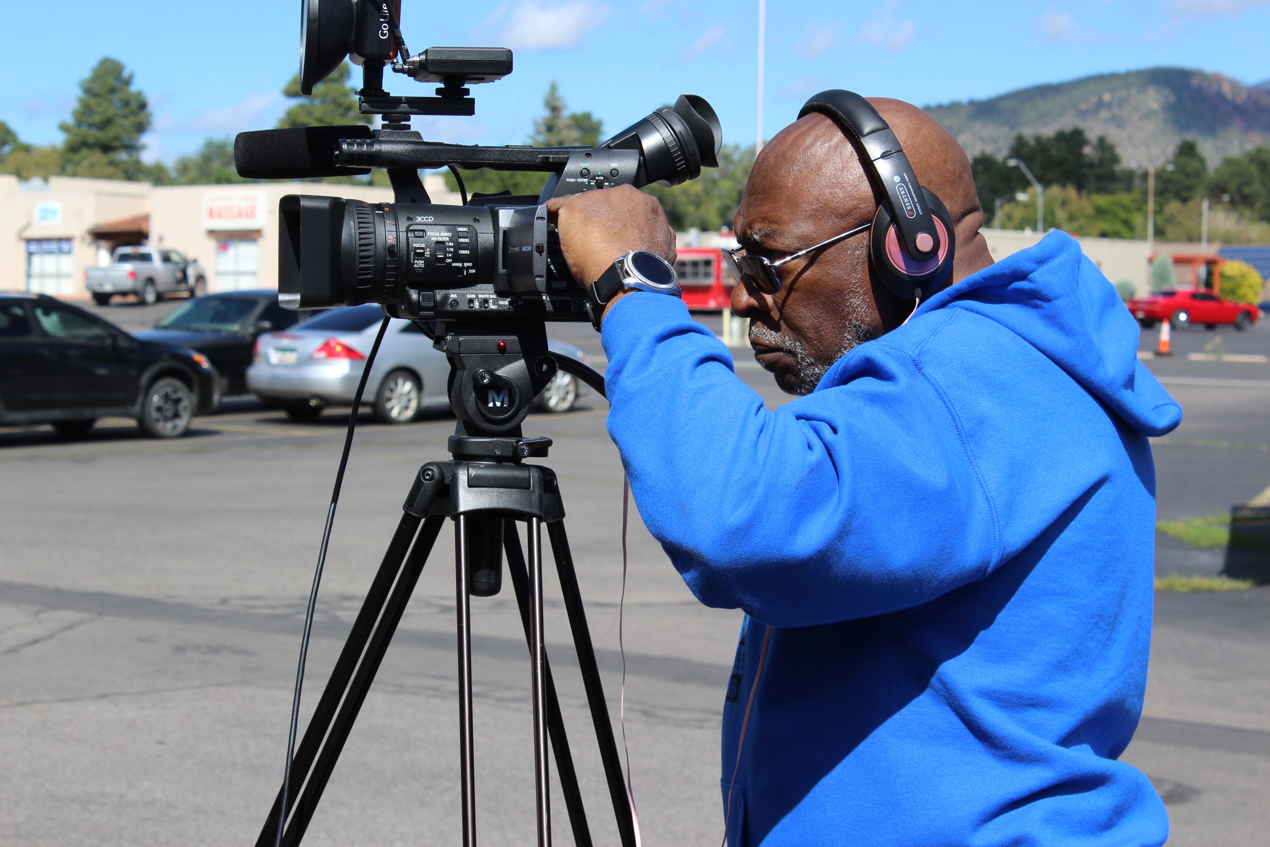 Filmmaker interviewing subject at outdoor community event
